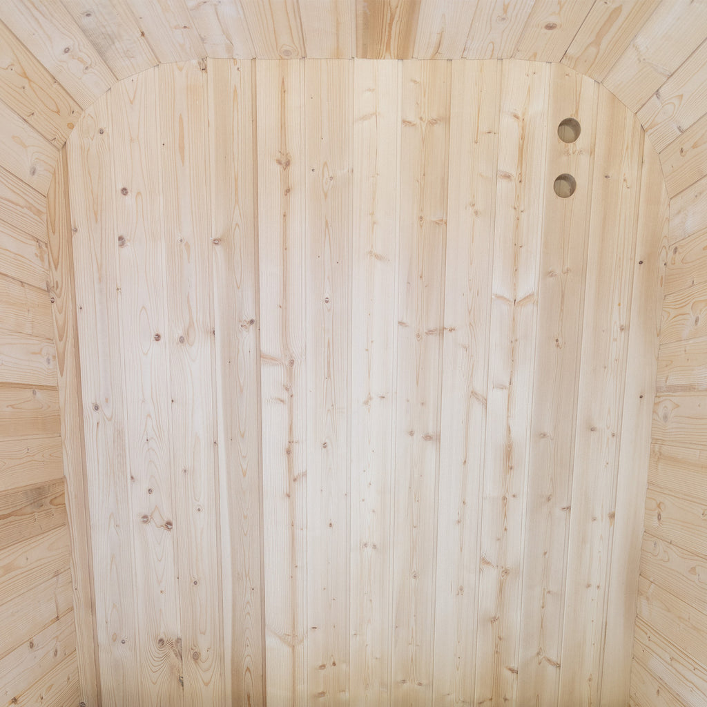 Auris One cedar sauna interior with wood-fired heater